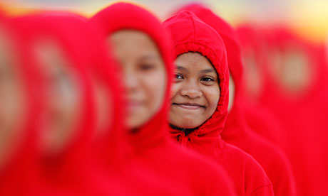 A girl smiles as she waits to perform during Malaysia's National Day celebrations in Kuala Lumpur
