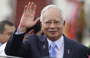 Malaysia's Prime Minister Najib Razak waves as he arrives at Naypyitaw international airport to attend 24th ASEAN Summit May 10, 2014. 
Myanmar chairs the 10-member Association of Southeast Asian Nations (ASEAN) this year. REUTERS/Soe Zeya Tun (MYANMAR - Tags: POLITICS)